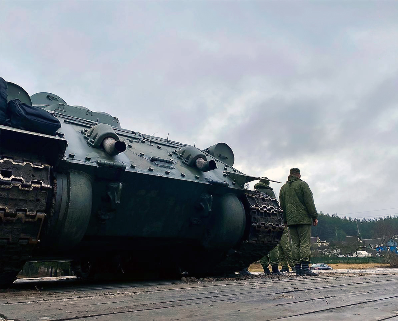 A troop train carrying T-34 tanks intended for a military parade being unloaded at Ozerishche station, 2 of 5