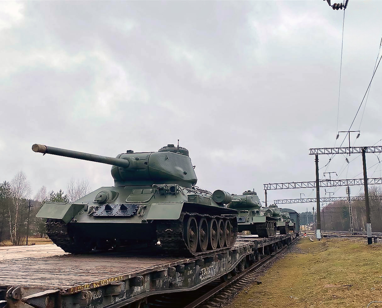 A troop train carrying T-34 tanks intended for a military parade being unloaded at Ozerishche station, 3 of 5